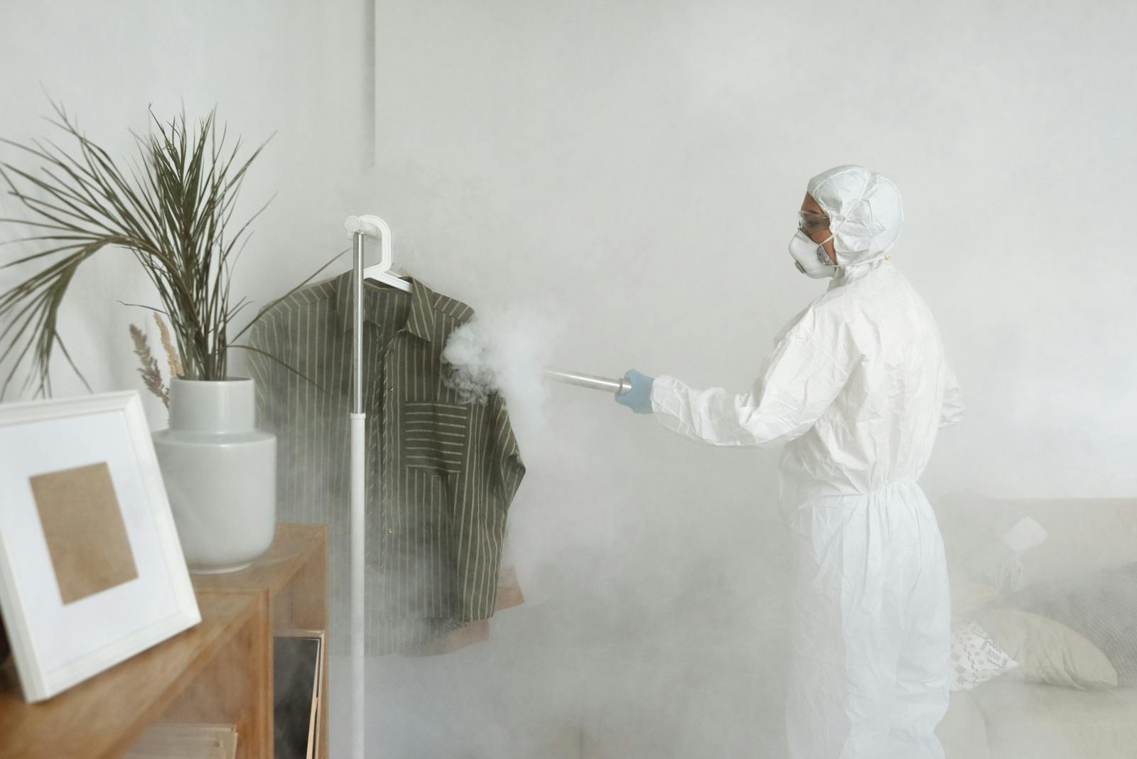 Protective-suit cleanup team working inside a residence